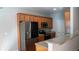 Updated kitchen with granite counters, stainless steel appliances, and wood cabinets at 2476 Suwanee Pointe Dr, Lawrenceville, GA 30043