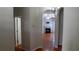 Living room view through arched doorways with hardwood floors and fireplace at 2476 Suwanee Pointe Dr, Lawrenceville, GA 30043