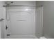 A bright bathroom featuring a shower-tub combo with a modern showerhead at 2476 Suwanee Pointe Dr, Lawrenceville, GA 30043