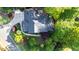 Aerial view of a home surrounded by lush landscaping and mature trees at 3102 Royal Troon, Woodstock, GA 30189