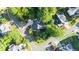 Scenic aerial view of a home nestled within a mature treed neighborhood at 3102 Royal Troon, Woodstock, GA 30189