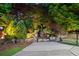 Backyard oasis with a stone waterfall feature and verdant landscaping at 3102 Royal Troon, Woodstock, GA 30189
