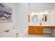 Primary bathroom with dual vanities, soaking tub, and bright vanity lighting at 3102 Royal Troon, Woodstock, GA 30189