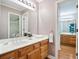 Bathroom featuring double vanities and a large mirror at 3102 Royal Troon, Woodstock, GA 30189