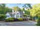 A clubhouse with white siding, a front porch and a covered walkway at 3102 Royal Troon, Woodstock, GA 30189