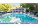 Community pool offering ample lounge chairs and covered pavilion space at 3102 Royal Troon, Woodstock, GA 30189