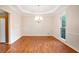 Elegant dining room featuring hardwood floors, a chandelier, and natural light at 3102 Royal Troon, Woodstock, GA 30189