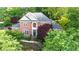 Beautiful brick home with lush landscaping, and an inviting entrance at 3102 Royal Troon, Woodstock, GA 30189