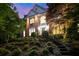 Inviting brick home with elegant landscaping and a grand entrance at 3102 Royal Troon, Woodstock, GA 30189