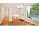 Bright foyer with hardwood floors, modern chandelier, and view to an outdoor patio at 3102 Royal Troon, Woodstock, GA 30189