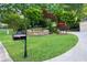 Landscaped front yard with flower beds and lush lawn at 3102 Royal Troon, Woodstock, GA 30189