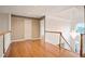 Hallway with wood floors and a chandelier at 3102 Royal Troon, Woodstock, GA 30189
