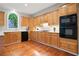 Kitchen with wood cabinets, modern appliances, and views of the backyard at 3102 Royal Troon, Woodstock, GA 30189
