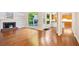 Open floor plan with living room, kitchen, hardwood floors, and natural light at 3102 Royal Troon, Woodstock, GA 30189