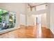 Open-concept living room with hardwood floors and view to outdoor patio at 3102 Royal Troon, Woodstock, GA 30189