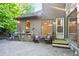 Backyard patio featuring an outdoor kitchen, seating area, and easy access to indoor living at 3102 Royal Troon, Woodstock, GA 30189