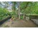 Expansive backyard with a swing, seating area, and playhouse provides a private retreat at 621 Mcgruder Ne St, Atlanta, GA 30312