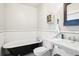 Cozy bathroom with clawfoot tub, subway tile, modern toilet and pedestal sink at 621 Mcgruder Ne St, Atlanta, GA 30312