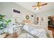 Bright bedroom with hardwood floors, a makeup table, and a walk-in closet provides ample storage at 621 Mcgruder Ne St, Atlanta, GA 30312