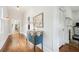Elegant entryway with hardwood floors, decorative chest and mirror, with views to other rooms at 621 Mcgruder Ne St, Atlanta, GA 30312
