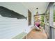 Nautical-themed front porch featuring a whale decoration and a comfortable egg chair with a dog at 621 Mcgruder Ne St, Atlanta, GA 30312