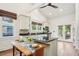 Bright kitchen with granite counters, island, stainless appliances, hardwood floor, and eat-in breakfast area at 621 Mcgruder Ne St, Atlanta, GA 30312