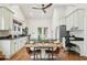 Bright kitchen with modern appliances, center island, and dining table with hardwood floors at 621 Mcgruder Ne St, Atlanta, GA 30312