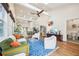 Spacious living area with open layout, vaulted ceilings, hardwood floors, and access to the kitchen at 621 Mcgruder Ne St, Atlanta, GA 30312