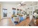 Open-concept living room with vaulted ceilings, skylights, modern furnishings, and hardwood floors at 621 Mcgruder Ne St, Atlanta, GA 30312