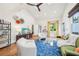 Bright living room featuring vaulted ceilings, stylish decor, hardwood floors, and comfortable seating at 621 Mcgruder Ne St, Atlanta, GA 30312