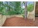 View of the fenced backyard featuring a newly constructed wooden fence and stairs at 146 Mount Paran Ne Rd, Atlanta, GA 30342