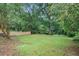 Lush backyard with a newly constructed wooden fence at 146 Mount Paran Ne Rd, Atlanta, GA 30342