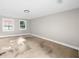 Empty basement room featuring two windows and concrete flooring at 146 Mount Paran Ne Rd, Atlanta, GA 30342