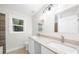 Bathroom features a double sink vanity, tile floors and modern fixtures at 146 Mount Paran Ne Rd, Atlanta, GA 30342