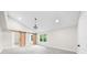 Bright bedroom featuring a chandelier, a window, and a barn door to the bathroom at 146 Mount Paran Ne Rd, Atlanta, GA 30342