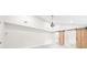 Bright bedroom with vaulted ceilings, modern chandelier, and barn door to closet at 146 Mount Paran Ne Rd, Atlanta, GA 30342