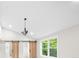 Bedroom featuring a decorative chandelier, hardwood floors, a window and barn doors to bathroom at 146 Mount Paran Ne Rd, Atlanta, GA 30342