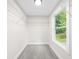 Walk-in closet with window and wire shelving for organized storage at 146 Mount Paran Ne Rd, Atlanta, GA 30342