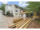Contemporary home features a white exterior, attached garage, and partially covered deck area at 146 Mount Paran Ne Rd, Atlanta, GA 30342