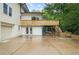 Exterior view of home showcasing backyard access, a deck, and driveway at 146 Mount Paran Ne Rd, Atlanta, GA 30342