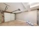 View of the spacious garage with overhead door and storage space at 146 Mount Paran Ne Rd, Atlanta, GA 30342
