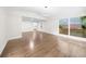 Bright, open living room featuring hardwood floors and large windows allowing ample natural light at 146 Mount Paran Ne Rd, Atlanta, GA 30342