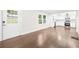Hardwood floors lead to a modern kitchen in this home with bright, white walls at 146 Mount Paran Ne Rd, Atlanta, GA 30342
