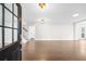 Spacious living room featuring gleaming hardwood floors, white walls, and recessed lighting at 146 Mount Paran Ne Rd, Atlanta, GA 30342