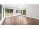 Bright sunroom with hardwood floors, lots of windows, and access to the backyard at 146 Mount Paran Ne Rd, Atlanta, GA 30342