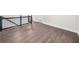 Upstairs hallway featuring black railings, hardwood floors, and white walls at 146 Mount Paran Ne Rd, Atlanta, GA 30342