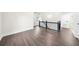 Upstairs hallway with hardwood floors, black railings, and doors to bedrooms and bathrooms at 146 Mount Paran Ne Rd, Atlanta, GA 30342