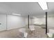 This spacious finished basement has neutral carpet, recessed lights, and features white furniture at 201 E Simon Nw Ter, Atlanta, GA 30318