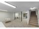Spacious carpeted basement with recessed lights, stairs and features a door to the exterior at 201 E Simon Nw Ter, Atlanta, GA 30318