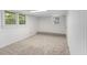 Finished basement showcasing carpet floors, natural light and white walls with views to the exterior at 201 E Simon Nw Ter, Atlanta, GA 30318